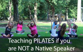 women doing pilates outside in the park