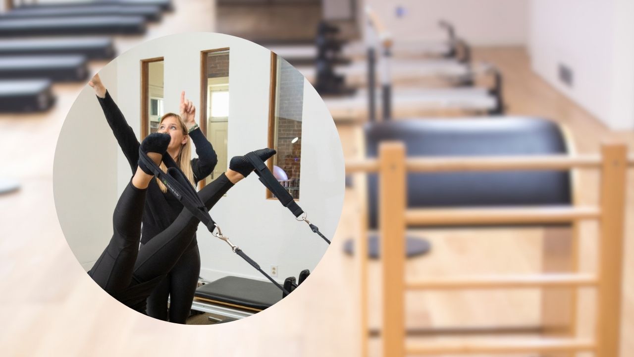 Pilates instructor teaching a client during a private session in a studio
